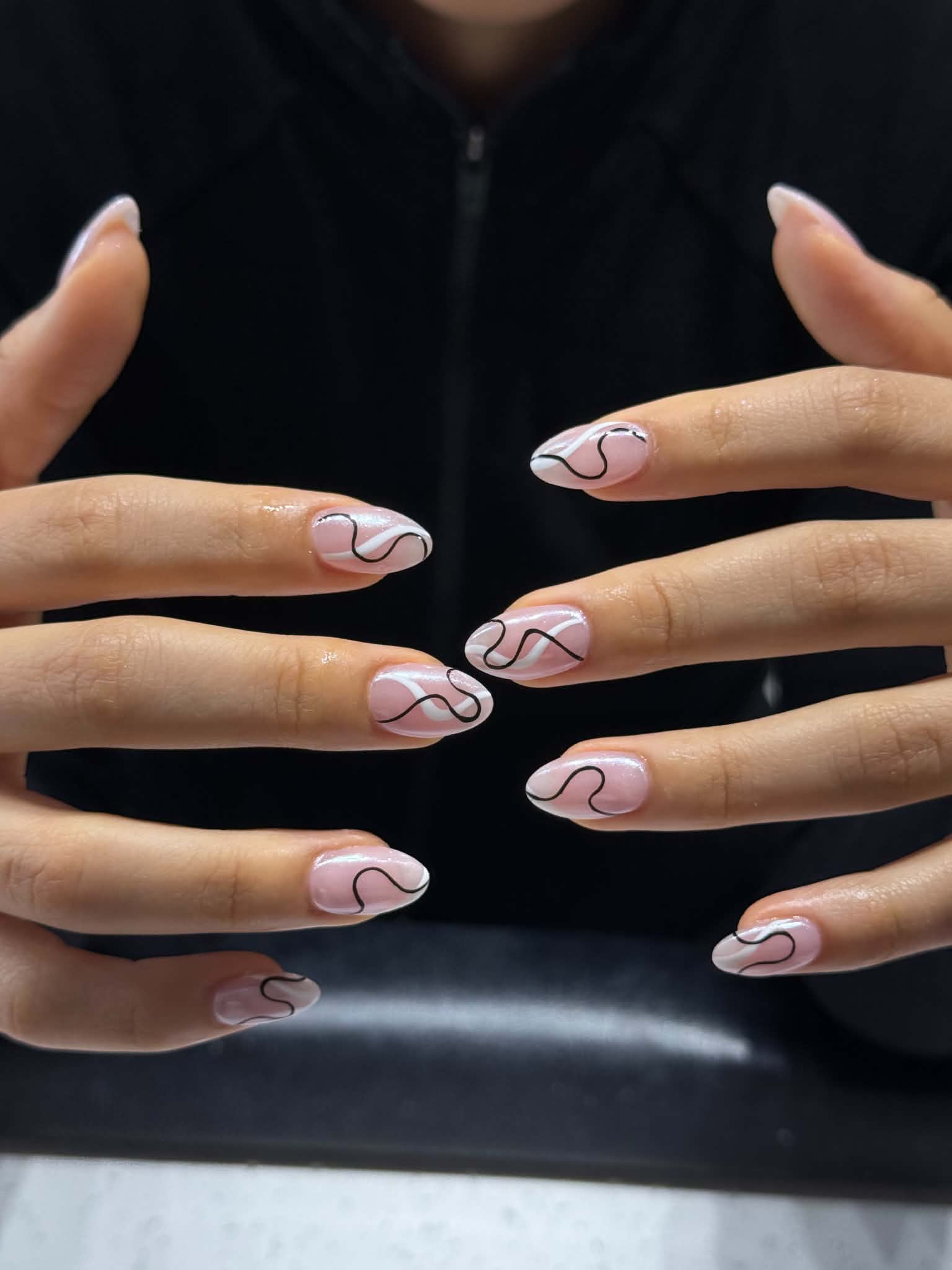 nude swirl lines nail design