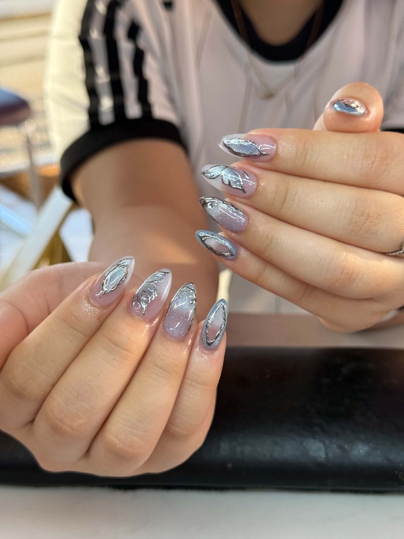 silver butterfly chrome nail design