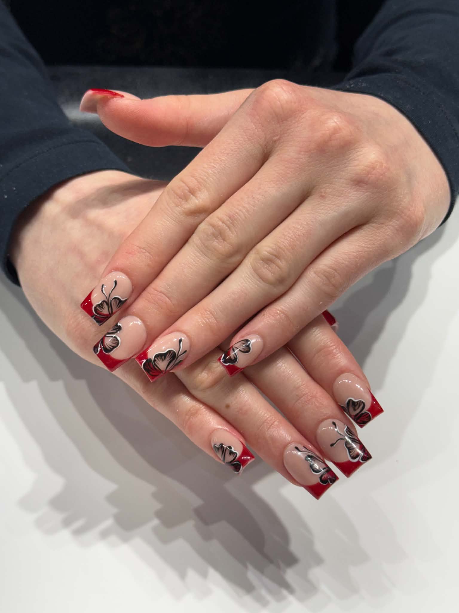 Radiance Nails & Spa red tips & little bows nail art
